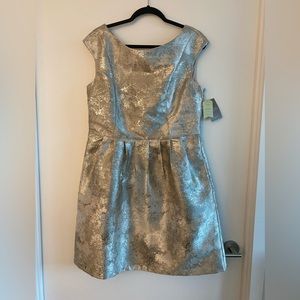 Silver cocktail dress from Anthro, size xl. New with tags. Some pulls on fabric.